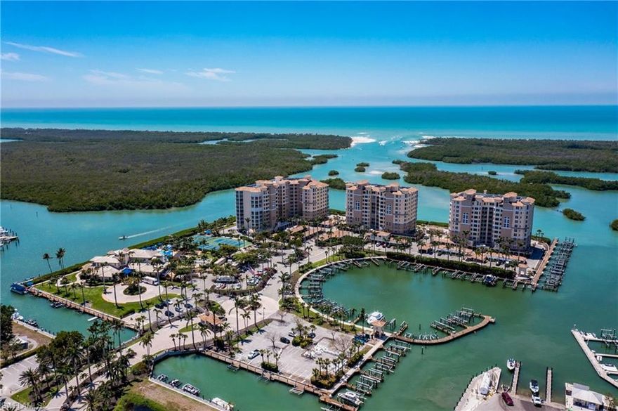 The stunning view will immediately capture your attention when you enter this beautifully appointed, neutral, bright, airy and open unit! Spectacular views of the gulf and mangroves will enchant you at all hours of the day. Start your perfect day with coffee and a view or take in the magnificent sunsets from your large screened lanai to wind down from your busy day in paradise! The renovated kitchen was taken down to the studs and completely remastered. Recent backsplash & gorgeous new quartz counters were added. Enjoy the new guest bath, recent updates to master bath & new impact glass in Fall 2019. At 2677 sf you have ample space to entertain friends & family. Membership at Pelican Isle Yacht Club is available to buyers at the Residences. Great Yacht Club dining room & bar are a favorite spot for gathering w/friends & enjoying fun social events. Tennis & pickle ball courts, multiple pools, full exercise facility and Beach shuttle for members complete this amazing lifestyle! 5 minutes to add'l shopping/restaurants!