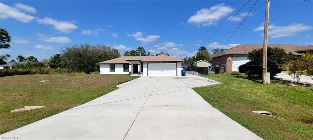 Photo of 1123 Summa BLVD, LEHIGH ACRES, FL 33974 (MLS # 226005726)