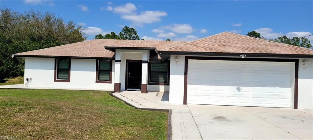 Photo of 1123 Summa BLVD, LEHIGH ACRES, FL 33974 (MLS # 226005726)
