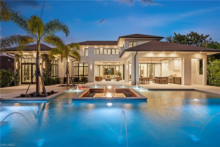 Just completed, this new home in Olde Naples with southern exposure is located just blocks to gulf beaches and the future Four Seasons Resort. Designed by Falconer Jones and built by Equinox Construction Group with 6 bedrooms and 5 full baths plus main level powder room & dedicated pool bath this professionally designed fully furnished home is a must see.  The interior features include an elevator, main floor office, state of the art chef’s kitchen with butler's pantry, large dining area with wine cooler and glass sliding doors that completely pocket to open the house seamlessly to the large lanai. The outdoor living and entertaining area with summer kitchen surrounded by an oversized resort style pool and grand fire pit with built in seating offer the ideal setting to enjoy the Florida lifestyle.  Exterior features include roll down screens and shutters, shell stone decking, whole house generator, full circular driveway and 3-car garage parking.