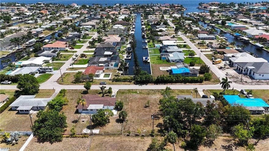 "Build Your Dream Home on this Residential Lot in a Coveted Area of Southeast Cape Coral" Discover the perfect opportunity to construct your dream home on this residential lot, located in one of the most desirable areas of Southeast Cape Coral. Situated in close proximity to all the exciting attractions and amenities the Cape has to offer, this location also provides a peaceful retreat away from the hustle and bustle of noise and traffic. Take advantage of the nearby beach and yacht club complex, offering a multitude of recreational activities. Additionally, the marina is currently undergoing restoration and upgrades, ensuring an enhanced boating experience for residents. It is worth noting that this particular lot is one of the rare few available in this highly sought-after area. Seize the chance to invest in the heart of Cape Coral now, while the opportunity still exists. Don't miss out on the chance to create your ideal living space in this prime location.