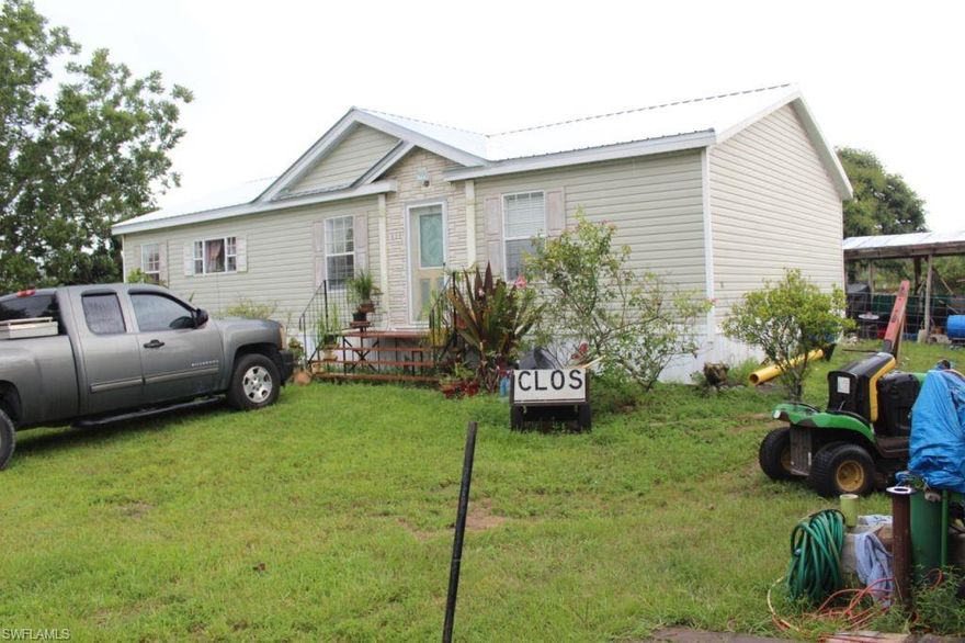 This beautiful mobile home comes with 3 bedrooms, 2 baths and sits on 1.25 acre lot in Montura Ranches. Built in 2006 this exquisitely kept home of over 1400 sqft has a brand new roof done in June 2020 with warranty, AC unit 3 years, water heater 6 years, well pump 2 years and a washer and dryer. The entire 1.25 acre lot is fenced, full of fruit trees, exotic plants, a fully matured pecan tree, barn, 55 and 20 foot shipping containers filled with every possible tool and additional storage.