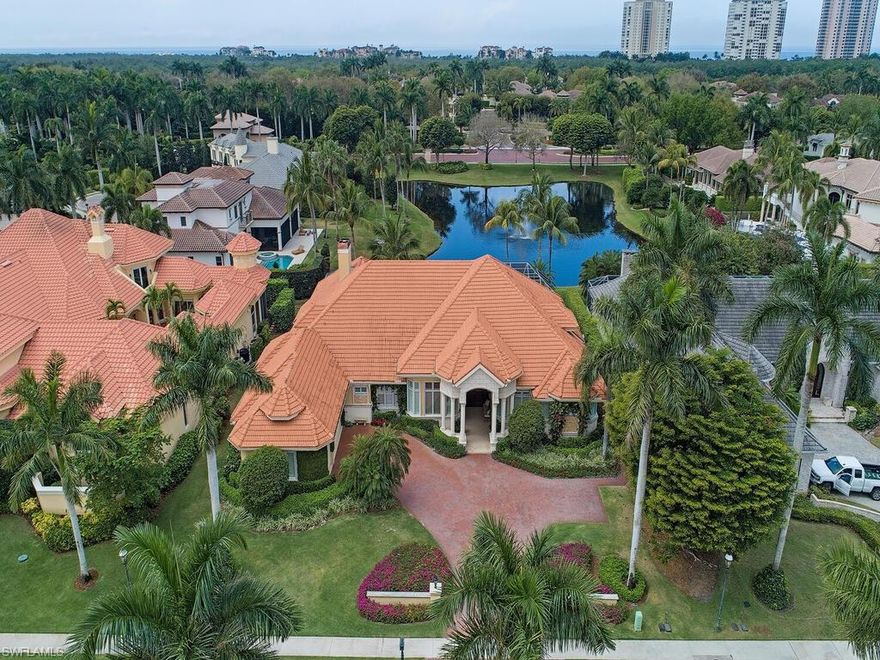 The ultimate in luxury lifestyle can be yours in this prestigious Bay Colony Shores estate home. Absolutely stunning - a most desired lakefront lot with southwestern exposure offering wide and long lake and sunset views. This four bedroom plus den, four and a half bath pool home has seen extensive remodeling, along with meticulous round the clock care maintained by Bay Colony's Signature Services. Spacious and private, inside and out - with volume ceilings, oversized screened-in lanai with outdoor kitchen and fireplace  as well as a custom, integrated heated pool and spa overlooking the lake. The gourmet kitchen is a home chef's dream - with double islands, breakfast bar, double wall oven and island cooktop as well as a Sub-Zero refrigerator, built in wine fridge and two cooled beverage drawers. Large master suite with separate his and her's bathroom areas. Beautiful hardwood floors in living room and office. Formal dining and living room, as well as a family room with fireplace. 

Bay Colony is the most prestigious beachfront gated community in Naples, Florida. Amenities include 3 resort style private beach clubs with restaurants, fitness center, tennis courts and more.