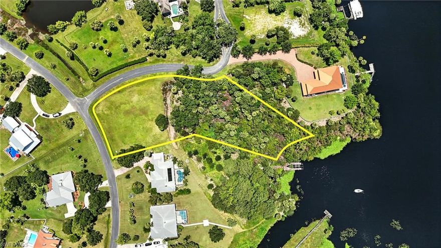 Build Your Dream Home on 1.44 acres in Riverwind Cove! Discover the perfect blend of space, serenity, and waterfront living with this expansive 1.44-acre homesite in the sought-after Riverwind Cove community. Situated along the banks of the Caloosahatchee River, this prime parcel offers direct access to one of Southwest Florida’s most beautiful and navigable waterways, perfect for boating, skiing, tubing, and fishing. Surrounded by mature oak trees and upscale homes on spacious lots, this property provides the peace and privacy of country living with the convenience of nearby amenities. You're just minutes from Babcock Ranch, where you’ll find Publix, restaurants, shopping, and community events. Riverwind Cove is a quiet, deed-restricted neighborhood known for its rural charm, friendly atmosphere, and holiday spirit! Whether you're planning a custom estate, a riverfront retreat, or a peaceful getaway, this lot offers the space and setting to bring your vision to life. Vacant land in Riverwind Cove is limited, don’t miss your chance to own one of the few remaining parcels. Call today before it’s gone!