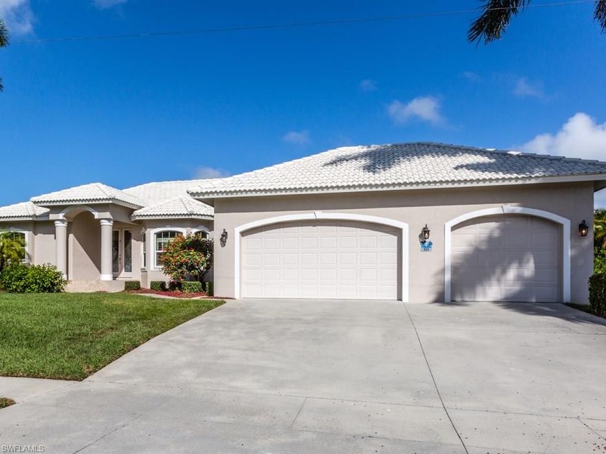 Priced to Sell!  Located amongst newer million dollar plus homes.  3 bedrooms and 3 full baths (one is a pool bath).  Updated kitchen with granite, stainless appliances and pantry.  Master suite with spacious custom closet, updated bath with his & her sinks and large walk-in shower.  2nd bedroom has a walk-in closet and opens to the lanai.  Fully storm protected with impact glass, electric and manual shutters.  Dock with quick direct access to the Gulf.  3 car garage with utility tub, cabinets, tool/work bench and rear garage door for your water toys.  Close to marina, shopping and restaurants.