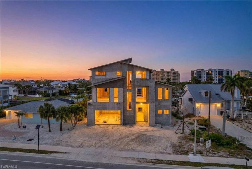 Welcome to Casa Verde Mar, a NEW CONSTRUCTION, certified GREEN HOME built by Imperial Homes, featuring a FULL-SIZE PICKLEBALL COURT with high-end furnishings & interior design by Clive Daniel Home! Ideally located on the highly desirable South End of Fort Myers Beach, this exceptional waterfront residence offers outstanding boating access while redefining modern island luxury. The home provides 4,610 square feet of living space under air with 5 total bedrooms complemented by 5 full baths & 2 half baths, tons of multi level covered outdoor living space, 2,075 square feet of garage & storage space accommodating the full-size pickleball court or a 6 car tandem garage. A massive elevated pool deck showcases a 350-square-foot pool & spa package with a dedicated second-level pool bath, while a brand new seawall, covered boat dock, captain’s walk & boat lift place you just moments from the open waters of Estero Bay & the Gulf. The 1st living level is designed for both everyday comfort & entertainment, featuring an expansive great room, a stunning chef’s kitchen with oversized island & hidden Butler’s Pantry, powder room, wet bar, lounge or office space & an impressive owner’s suite as well as a generous guest suite. Sliding glass doors seamlessly connect the interior to a covered outdoor living area complete with a summer kitchen & pool bath, creating the perfect setting to enjoy the Florida lifestyle. The second living level offers three additional guest suites, including a VIP suite with walk-in closets and a large bath, plus a living area with bar, home office & access to a covered patio. Additional highlights include native landscaping; Aercon lightweight aerated concrete block construction with R-values exceeding code by 20–30%; a solar power system with three 54-kW Tesla battery storage units; electric vehicle charging; full smart home automation & energy monitoring; standing seam metal roof; Sub-Zero and Wolf appliances; Electrolux washer and dryer; 3-zone high-efficiency A/C system; whole-home speaker wiring; & roll-down bug screens & hurricane shutters on covered outdoor spaces. Contact for Full Spec Sheet! Finishes may still be selected for a limited time, offering a rare opportunity to personalize this extraordinary home! Call today to schedule your private showing & start living the SW Florida lifestyle in Paradise Today!