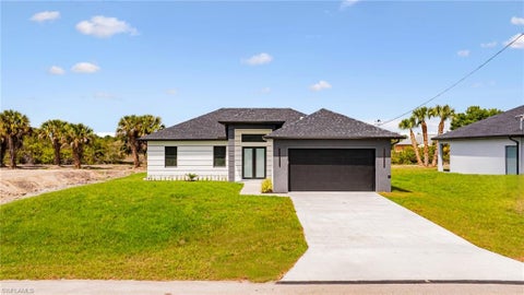 Photo of 815 Frederick Reid ST E, LEHIGH ACRES, FL 33974 (MLS # 226037890)