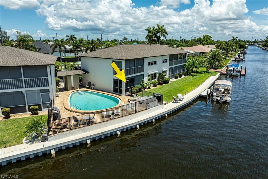 You can’t beat the beauty and location of this fully renovated gulf access condo. You can watch the sunrise, dolphins, and manatees right from your lanai or cast a rising rod right off the dock! This 1st floor condo is being offered partially furnished and offers walk out access to the community pool, and boat docks. Boat docks are first come first serve (there is current availability). There is also a new project in the works to build more docks offering additional dock space for residents. This canal is extra wide and has quick access to open water with 1 bridge out to the Caloosahatchee River. This development has many new upgrades including boat docks, captain’s walk, irrigation, and a new roof. Inside the home you will find everything is brand new including the hot water heater. A home warranty will transfer with the sale and is good through Jan '29. You will love the tile that is throughout the home, stunning white kitchen with quartz counters, two remodeled bathrooms, and all fresh updated paint colors. This home is unusually bright and airy due to multiple windows and sliders overlooking the canal! Your Primary Bedroom has its own slider to the lanai so you can wake up to views of the water! Flood insurance is covered in the HOA fee. All assessments are paid on this unit. This location is a very short bike ride/drive to downtown (47th Terr) and close to the new Bimini Basin Project which will offer health care, restaurants and shopping. See it today!