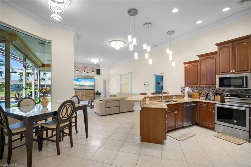 Welcome to 5024 SW 8th Place, a stunning Gulf-access home available for long-term or short-term rental in one of Cape Coral’s most desirable neighborhoods. Originally built as the builder’s own residence, this home offers exceptional quality and elegant finishes throughout. Enjoy high ceilings, crown molding, and polished porcelain tiles in the master bedroom and bathroom. The spacious master suite includes walk-in closets and a spa-like bath, while the modern kitchen opens to a panoramic glass view of the pool, canal, and new boat dock. Relax and entertain by the newly resurfaced pool with screened enclosure, pool heater, and electric hurricane shutters for added comfort and safety. The long driveway provides ample parking and excellent curb appeal. Perfect for those seeking a luxurious Florida lifestyle, whether for a seasonal stay or a full-year rental—this home truly offers the best of waterfront living in Cape Coral.