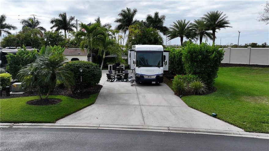 Welcome to 4628 Southern Breeze Drive in the prestigious Pelican Lake Motorcoach Resort, one of Naples’ premier luxury motorcoach communities. Offered at $155,000, this beautifully landscaped over 4,500 sq ft lot provides privacy, comfort, and resort-style living at its finest.
The north/east-facing orientation offers ideal sunlight throughout the day, while the lot is surrounded by a lush variety of tropical palms and plants, creating a serene and private outdoor retreat. With no neighbors to the north, enjoy enhanced privacy and peaceful views.
The property features a fully finished accessory building, remodeled in 2025, perfect for entertaining, relaxing, or additional storage. The coated concrete slab offers durability and a clean, polished look for your motorcoach setup.
This lot is being sold turnkey, with all Polywood-style outdoor furniture included, along with the umbrella and built-in grill, allowing you to immediately enjoy the Florida lifestyle with no additional expense.
Pelican Lake Motorcoach Resort offers luxury amenities, a prime Naples location close to shopping, dining, and beaches, and an active social atmosphere. This is an exceptional opportunity to own a private, upgraded lot in one of Southwest Florida’s most sought-after motorcoach resorts.