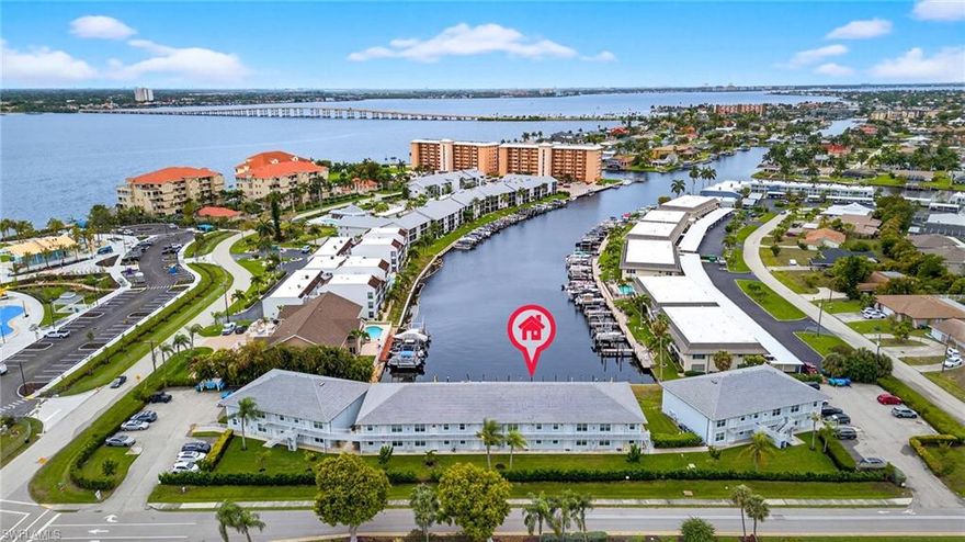 One of the best south-facing canal views you’ll find on direct access water in Cape Coral—especially at this price. And right next door? Jaycee Park, freshly redone with a boardwalk, open green space, and room to get outside and connect. A planned bistro may soon make it even easier to grab a drink or a bite without going far.
The unit sits on the second floor of Ocean Isle Riverview—no upstairs neighbors, and just enough elevation to take in the canal views as boats pass through on their way out. Offered turnkey for convenience, the space feels open and comfortable with slightly higher ceilings, recessed lighting, and natural light throughout. Solid concrete floors and block construction adds a sense of durability and quiet.
But the real story is in how it’s been rethought.
The kitchen is practical and open, designed for real use. Quartz counters, 42-inch cabinets, and newer appliances are paired with a repositioned sink that improves flow and opens up the bar—creating a natural place to gather, talk, and linger a little longer.
It flows into the living area, where the canal naturally becomes the focal point. Step out onto the lanai with full southern exposure—ideal for morning coffee or simply letting the day slow down a bit.
The primary bath has been opened up with a larger shower, clean lines, and no wasted space. Throughout the home, details quietly do their job: luxury vinyl plank flooring, built-ins where they matter, updated trim, and a front entry that sets the tone. HVAC replaced in 2022.
Impact-rated windows provide efficiency and help maintain a quiet interior. The building has also been updated with a slate tile roof, fresh exterior paint, lighting, and refreshed landscaping.
And then there’s the water. Direct boating access out to the river, with dock space available on a first-come basis. A new dock is planned, and the seller will address upcoming assessments.
The community offers flexibility without excess—no age restrictions, pet-friendly with approval, and rentals permitted with a two-week minimum. 
Monthly dues cover reserves, insurance, management, and maintenance—keeping ownership straightforward. If you’ve been waiting for the right combination of location, updates, and waterfront access, this is worth seeing in person.