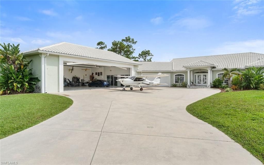 Photo of 18683 Baseleg AVE, NORTH FORT MYERS, FL 33917 (MLS # 226005763)