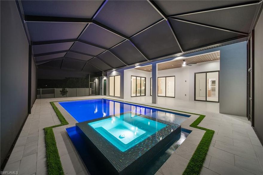 Stunning open-concept Gulf Access home on an oversized lot with private dock, pool, and spa, plus an outdoor kitchen. The modern kitchen features Quartzite Cristallo countertops, DACOR luxury appliances, panel-ready freezer, wine fridge, and a stylish bar with high-end finishes. A separate coffee station adds a perfect touch for morning routines. The home boasts luxurious 48x48 Spanish porcelain floors, creating a spacious and modern feel throughout. Bathrooms are finished with exclusive Spanish porcelain from Porcelanosa. Enjoy a built-in SONOS sound system, spacious walk-in closets, and a laundry area included. Centrally located in a beautiful neighborhood, this home offers the perfect blend of elegance, comfort, and Florida waterfront lifestyle.