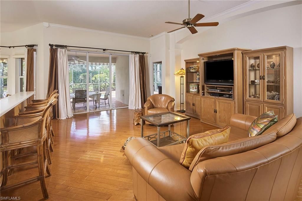 Photo of 9301 Troon Lakes DR, NAPLES, FL 34109 (MLS # 226011328)