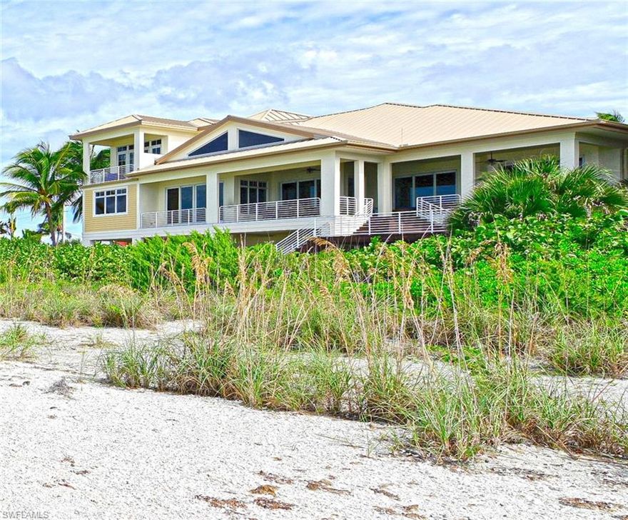 Rare 100' direct beach front estate situated on two beach front sites totaling well over half an acre. Modern hurricane code home inc impact glass, electric shutters, standing seam roof, & concrete block construction. This property offers sweeping Gulf of Mexico views. The styling of this home is modern coastal with extensive tongue and groove work throughout. Large rooms, open floor plan, first floor master, volume ceilings incredible outdoor decks with 180 degree views of the Gulf.  Additionally, the living area is a two story great room both inside and outside and features large fireplace and wood ceilings and floors.  The gourmet kitchen and dining room are also right on the gulf. This home has room for an elevated pool and spa if desired, also includes private rear beach stairway. The master bath offers jetted tub, glass shower with seat, and his and her vanities. The guest areas of the home are all generously sized & inc two beach side VIP guest suites. The beach level entertaining features living area, summer kitchen, covered lanai, & extensive garages with beach toy storage. Drive way and motor court parking are a plus for entertaining.