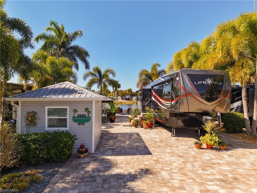 Stunning is the only description that fits Lot D72 in beautiful Cypress Woods RV Resort!!  Sit and relax on this lake front lot and enjoy what sunny Florida has to offer.  This full paver lot with knee wall has been sealed and protected.  The fully permitted accessory building has been newly remodeled, with mini split, hot water on demand, toilet, shower, washer, dryer, refrigerator, sink and bar for your enjoyment.  the rear positioned gazebo with electronic shades and separate door shade, makes outdoor living a dream.  this is a luxury ownership resort that offers many amenities including, shuffleboard, pickleball, tennis, as well as a calendar full of events that take place.  the Welcome Center has resort offices, card room, fitness center, laundry, day spa, and pool/hot tub.  the Town Center has large meeting room, catering kitchen, card room, craft room, craft room, and pool/ hot tub.  Come and see this RV lot close to what South West Florida has to offer!!