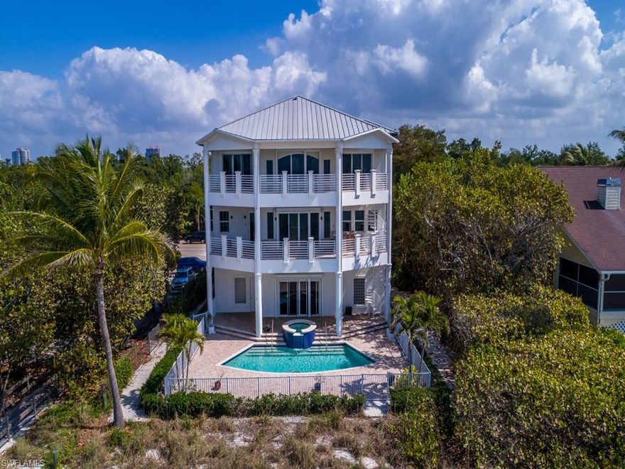 This a rare opportunity to own a piece of paradise on a lot and a half with 75 ft of frontage on the Gulf of Mexico.  Tandem garages that can accommodate 4 cars, plus oversized driveway for additional family or guests.  Beautiful three-story home built in 2002 with amazing and massive volume ceilings and travertine floors throughout.  Wraparound balconies providing outdoor access from which to watch dolphins play and unobstructed sunset views from every angle.  Inviting pool and spa beachside.   The home has been recently renovated and is ready for the new owner’s personal touches to make it a true masterpiece.  Elevator servicing upper floors.