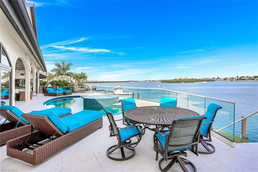 VIEWS VIEWS VIEWS!! and BOATERS DREAM! 172 feet of panoramic views on the bay! This spectacular residence was completely renovated in 2016! All impact rated windows and doors * custom floating staircase, open kitchen, great room floor plan including a walk behind wet bar- Master suite with sliders out to private patio * dual walk in closets, Marble bath with walk in shower, soaking tub and dual vanities.. 2 large guest suites on the main level and a private suite on the upper level with a private balcony.. Fantastic covered lanai space, pool with raised spillover spa, outdoor kitchen and plenty of sun deck to soak up the rays! This home is ideal for entertaining!! Boat Dock with 2 lifts PLUS Shore power and dockage for a 110 Ft Motor Yacht .. NEW METAL ROOF 2020