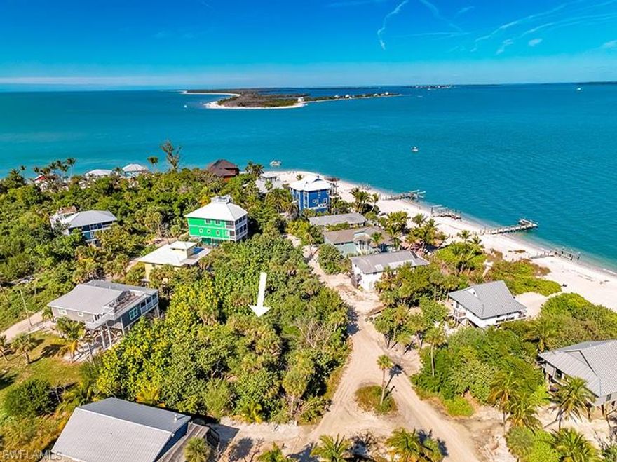 Exceptional opportunity to build your island dream home on this oversized corner parcel located just one row back from the Bay on beautiful North Captiva Island.
Positioned to capture fantastic panoramic views across Pine Island Sound, this rare homesite offers wide, open-water vistas, with only one row of homes between the lot and the bayfront. The corner orientation offers excellent design flexibility and added privacy, making this an ideal location for a custom home that maximizes views, breezes, and outdoor living. This property stands out not only for its size, but also for its ability to deliver true bay-view living without the price and limitations of direct waterfront ownership. From a well-designed upper-level living space or observation deck, you can enjoy sweeping sunrise views, passing boats, and the ever-changing colors of the Sound.
Located on North Captiva Island—a private, boat-access-only barrier island known for its pristine beaches, preserved natural areas, and charming golf-cart-only roads—this lot offers a peaceful island lifestyle surrounded by nature and water.  Oversized parcels with this combination of almost triple the size of nearby parcels, corner positioning, proximity to the Bay, and panoramic view potential are extremely difficult to find. This is a unique chance to secure a premier building site for a full-time residence, vacation retreat, or future investment.  This lot pairs well with the adjacent low-priced bayfront cottage listed at 131 Kingfisher Dr.