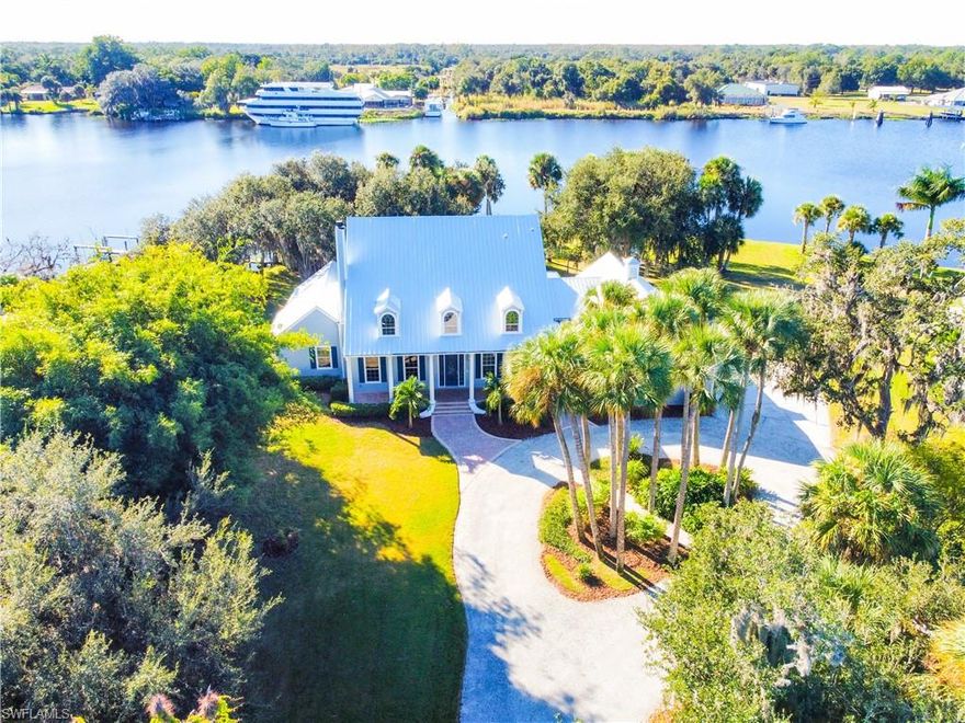 The Finest Luxury Riverfront Community in Alva is River Wind Cove . This is the Largest Riverfront home sitting on the largest point in the community.  Wide open large Great Room on natural wood floors & a family room featuring a marble hearth surrounding the Fireplace. Spectacular Kitchen with Granite Tops & massive cabinet & storage space. Kitchen also has center island with xtra sink. Upstairs has a beautiful balcony and game room. This spectacular designed home has 5 Bedrooms & 5 Bathrooms. The home features views of the river from almost every room. Boaters will enjoy a 28,000 #  Golden Aluminum Boat Lift & Large Composite Dock. Updated with  new galvalume metal roof 2025-3 New HVAC systems 2025 , New Wood floor surfacing 2025, new floor covering 2025, new light fixtures, + + +
3 Car Epoxy coated garage has 2 large bonus rooms above garage  for extra office or bedrooms.
The landscaping includes large mature oak trees and many other natural plants for a peaceful riverfront setting
Large homesite + ACOE