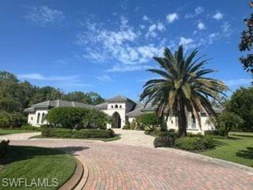 Privacy abounds with sweeping preserve views from this Florida Lifestyle built custom home.  Nestled on over an acre, this extensive home offers over 5470 square feet of luxury living and offering a transferable house membership to Quail West.  Peace of mind offered with a full home generator, impact glass and a 500 gallon propane tank. 5 garages ready to house your extensive auto collection. You will appreciate the fine attention to detail throughout, volume ceilings and beautiful cabinetry with extensive storage and prep surface in the kitchen, anchored by a generous island.  The Great Room design makes this a simply ideal home for entertaining. Additional features are Thermador appliances, wine refrigerator, dehumidifier for the entire house, 2 water closets in the primary bath and beautiful heated pool and spa in the extensive lanai with lavish outdoor living amenities including an outdoor kitchen and plenty of covered entertaining area.