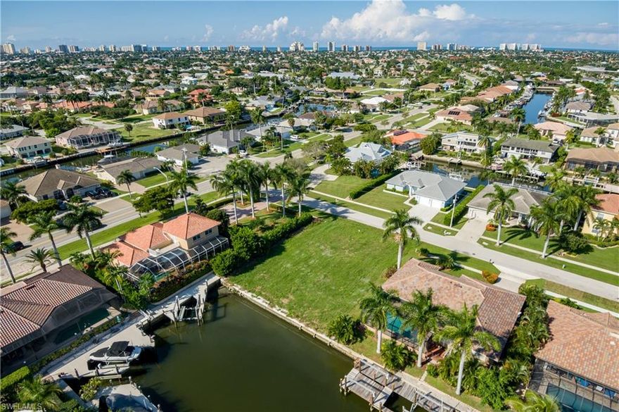 Beautiful homesite centrally located on beautiful Marco Island. This over-sized waterfront lot with 90 feet on the canal will accommodate a three car garage! Sewer assessment paid in full. Seawall is in excellent condition with a new cap. Lot offers lots of privacy on a very nice street with newer homes.