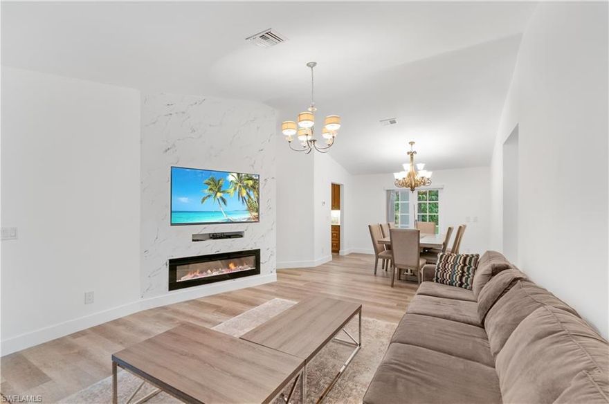 Unique opportunity to enjoy beautiful family compound on cleared 2.5 acres with newly installed irrigation system and low voltage lights on all palm trees.Brand new asphalt  circular driveway and pavers in the front and perimeters of the home .New architectural drawings available for possible extension as well as plans for the new gazebo .Horses are allowed and Target range on the back of the property! Perfect family estate home- WEST of Collier on 2.5 acres! This 4 bedroom, 3 bath home in great school district is set back on a beautiful, private lot with pines, palms and lovely gardens. Ranch style home with vaulted ceilings, an updated kitchen and many other improvements. Kitchen has wood cabinetry, beautiful granite counters, a tumbled marble backsplash, stainless appliances and new flooring extending to the great room. Living room has french doors leading to a large screened lanai area and the 696 sq. ft. deck . Many other seating areas have been created in the yard for both sun and shade options for relaxing, dining, entertaining and grilling. Plenty of  room for a pool and spa, growing your own food , fruit trees, adding another building, or parking your RV. Additional features include recessed lighting, a spacious master suite with a huge walk-in closet, an oversized jetted tub and walk-in shower. New water filtration system, shed and tile and laminate flooring throughout the home! Great location just N of Pine Ridge right off Collier! Minutes to I-75, and Naples white sand beaches, shopping, restaurants, galleries and museums.