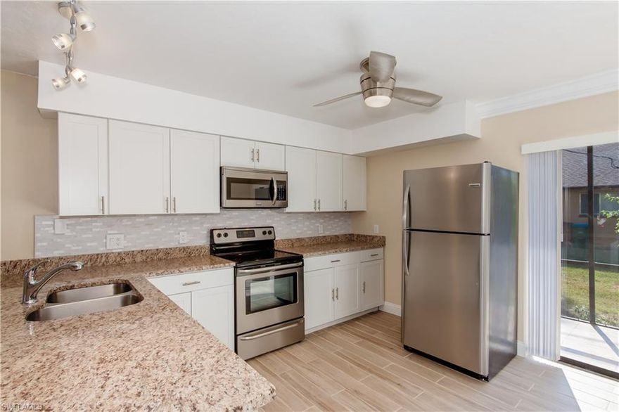 It doesn't get better than this! First floor, end unit, fully renovated and ready to move in. This condo is perfect for owner occupants or a rental. Centrally located walking distance to grocery stores, pharmacy, restaurants and businesses. This condo is located only 2 miles away from Cape Coral's Yacht club and beach. This unit has been completely updated including new plank tile, new paint, new AC unit, new tankless hot water heater and new baseboards. Both full bathrooms feature  new vanities, sinks and faucets.The kitchen features beautiful, modern white cabinets, all new matching stainless steel appliances and granite counter tops. This is one of the rare units in this price range that has been completely updated for you! Schedule your showing today, this will not last long!