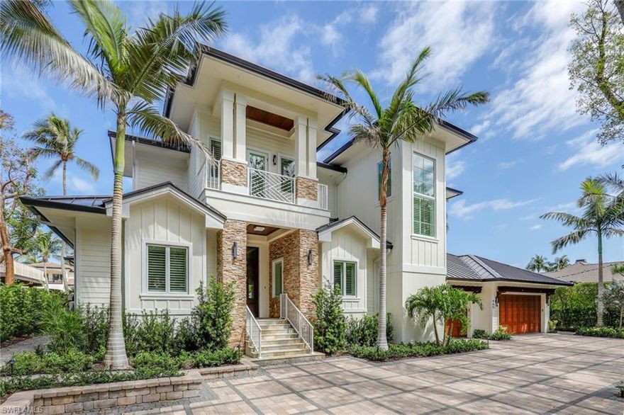 Bespoke waterfront residence perfectly situated in one of Naples' most sought-after neighborhoods, Aqualane Shores. Over 7,000 total sf of functional design and coastal living uniquely blended in this 4 bedroom plus den, 5 bathroom home. Located on a quiet Mahogany tree canopied street which runs directly to the beach. Ample outdoor living with boat dock and lift provides direct access to Naples Bay and the Gulf of Mexico. New seawall with over 100 ft of canal frontage. Impressive features include woodwork detail throughout, a 350-bottle climate-controlled wine cooler, natural gas, a whole-home generator, fully independent solar power system, 3 zone air conditioning, 3 car garage with dehumidifier, upper & lower lanais (4 total) with powered screens, lap pool, spa, outdoor shower and custom landscape lighting. A short walk to beach access, shopping and dining on 3rd Street S. Also, a quick bike or golf cart ride to 5th Avenue S. Built by award-winning custom home builder BUILD. One-of-a-kind property. Offered fully furnished.