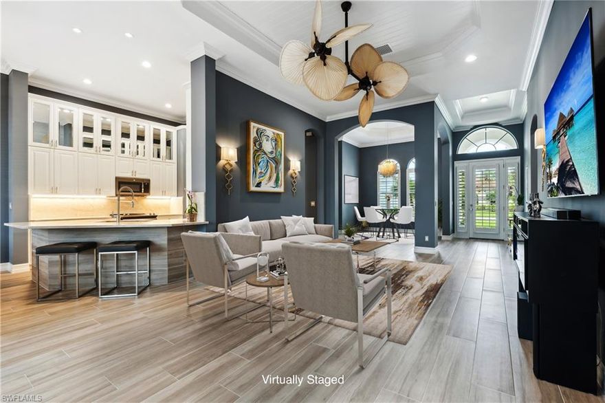 Welcome home to this stunning lakefront property that boasts 4-bedrooms, 3.5-bathrooms, a spacious 2-car garage, heated swimming pool with built in jacuzzi and so much more for your enjoyment and relaxation.

This property underwent an extensive renovation from top-to-bottom, inside to outside. This is your rare opportunity to own a completely renovated home in Madison Park where no expense was spared!

A short list of recently completed upgrades include: New High Efficiency AC (2023), new Pool, Cage and Decking (2023), Washer and Dryer, new Italian plank flooring throughout home, new granite and backsplash in kitchen, stainless steel appliances, crown molding, plantation shutters, upgraded lighting added throughout home, new BBQ and patio bar with custom stereo, new Interior paint (Walls, ceilings, doors, cabinetry, crown molding), new Exterior paint, epoxy coated garage floor with custom ceiling storage and much more.

Your new home is only a short drive to beautiful downtown Naples that offers world-class beaches, dining and entertainment. There is no better time than the present to purchase this amazing property located in one of the most sought-after communities in Naples!