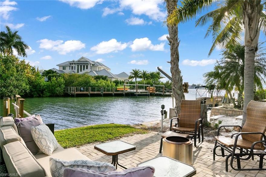 This unit faces the canal with lovely water views. Dock space is available for an additional charge.  Stunning views, two-level unit facing the canal with two separate sitting areas on the second floor.  One faces the canal and the other faces west towards Naples Bay. Kitchen and great room are on the first floor that lead out to the private outdoor sitting and dining area,  that also faces the canal.  Upstairs are two bedrooms.  The location is perfect for kayaking, canoeing, fishing off the dock, or just enjoying the stunning sunsets.  Also, there is a common area with seating, a fire pit, and a grill.  The location is just a short drive to 5th Avenue South, the Naples Pier, and pristine, white sandy beaches.  It is also a quick walk over the Tin City Bridge to all that 5th Avenue South and Third Street South, have to offer.