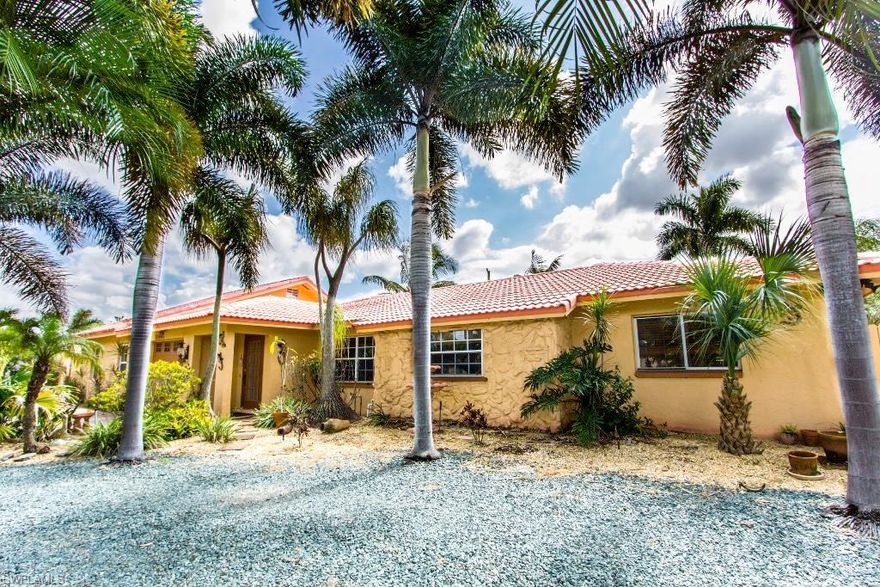 This One of a kind Pool Home is located just minutes to Ft. Myers Beach & Sanibel Island. The Property sits on an oversized Mature Palm Tree Lined .32 Acre lot with circular driveway.  The property includes an updated Main House with 3 Beds, 2 Baths & 1536 sqft living & an attached Fully Permitted 2-Story Guest House, which was built in 2005 & features 1 Bed, 1 Bath and a loft with 691sqft. A few important updates which need to be pointed out are, updated windows, Silestone countertops, Raised Panel Wood Cabinets, Stainless Steel Appliances, Update Guest bathroom, Updated master Bathroom, Tile Floor throughout living and Wood-Like Laminate in the Master Bedroom.  The Pool & Enclosure were added in 2005 to give the property a really “Beach” feel.  There is a one-car garage attached to the Main house, a 16x30 A/C Detached Garage, a 12x21 Shed & full RV Hook Up. There are so many options for this property, for instance, It would be ideal for extended families or would make a great vacation home for multiple families with 2 separate units **AGENTS PLEASE REVIEW COMMENTS