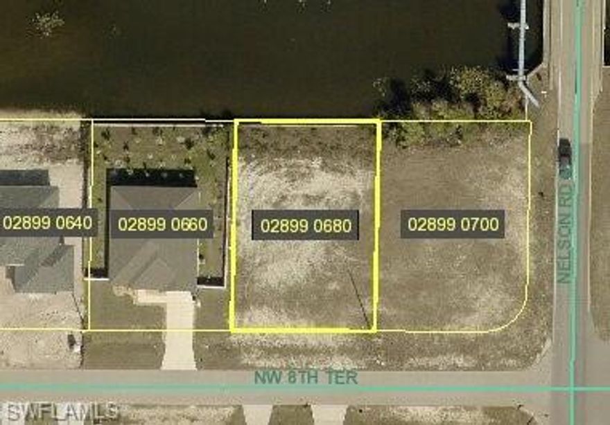 Build your dream home on this freshwater lot conveniently located just North of Pine Island Road. Easy Access to Fort Myers and Charlotte County with lots of shopping, restaurants and entertainment nearby. Kayak miles of freshwater canals/lakes and fish from your own back yard! Seawall is already built on this lot, that's a big ticket item completed!