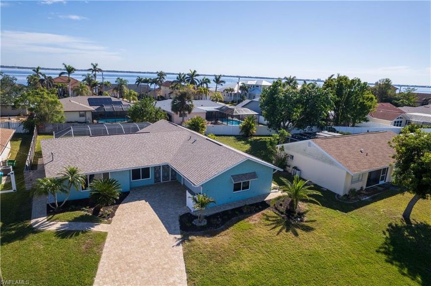 Back on the market and ready for new ownership!  Welcome to Paradise in SW Florida. The Cornwallis Neighborhood in SW Cape Coral, is a highly sought after Community with miles and miles of Gulf Access Canal homes. This Beautiful 3 BR, 2 BA, Pool Home sits just one block away from the Open Water of the Caloosahatchee River. The Custom Pavered Drive and Sidewalks lead to a side-entry oversized garage. Enter the home thru your Double Door Screened Entry to a Large Living area with Sliders to the Lanai. The Kitchen also accesses the Lanai and Pool, as well as the Guest Pool Bath. All Windows and Sliding glass doors are Hurricane Impact Resistant. And there is a Generac Whole House Generator with buried Propane Tank in place and ready if ever called upon.  The AC has been recently updated and a Brand New Full Electric panel was just installed.  The Homeowner carries a transferrable Flood Ins. Policy, but it is good to know that there was NO Water Flooding from any recent Hurricanes! The Roof was replaced in 2022. The Guest Bedrooms and Laundry Room are spacious and have new LVP Flooring. The Master BR also has a Sliding Door to the Screened Lanai, walk-in closet and updated bathroom. The best part is the backyard Oasis where you can relax sipping coffee in the mornings watching the sun rise, and your favorite beverage in the evening. The Backyard is also Fenced for the Family Pets and Kids, and the Pavered Pool Deck is great for Entertaining on your Screened Lanai. Enjoy this Saltwater Pool year-round. SW Cape Coral boasts a network of Restaurants, Shopping, Schools & Churches. And, it is just a short Drive or Boat ride to the World Class Beaches of the Gulf Coast. With Multi Million Dollar Homes in the neighborhood, this is a great opportunity to enjoy SW Florida to the fullest!