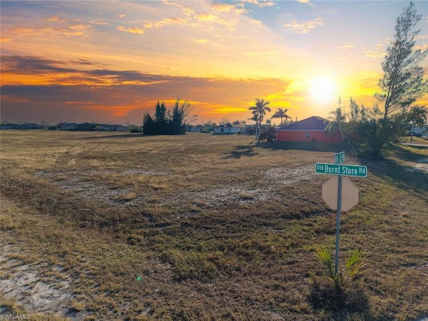 Build your dream home on this corner homesite in the rapidly growing Northwest Cape Coral area. Located just off Old Burnt Store Road, this residential lot offers desirable southern rear exposure, providing excellent sunlight for outdoor living spaces, a future pool, or a backyard retreat. Northwest Cape Coral continues to attract buyers seeking newer homes, larger lots, and room to grow, while still enjoying convenient access to shopping, dining, schools, and everyday amenities along the Pine Island Road corridor. The property is also positioned near the future Seven Islands development, an exciting planned waterfront destination expected to bring additional recreational, dining, and commercial opportunities to the area. Whether you are ready to build now or looking for a smart long-term investment, this well-positioned lot offers an affordable opportunity to secure your place in one of Cape Coral's most promising growth corridors. Optional floor plans are available through a local builder to help bring your vision to life.