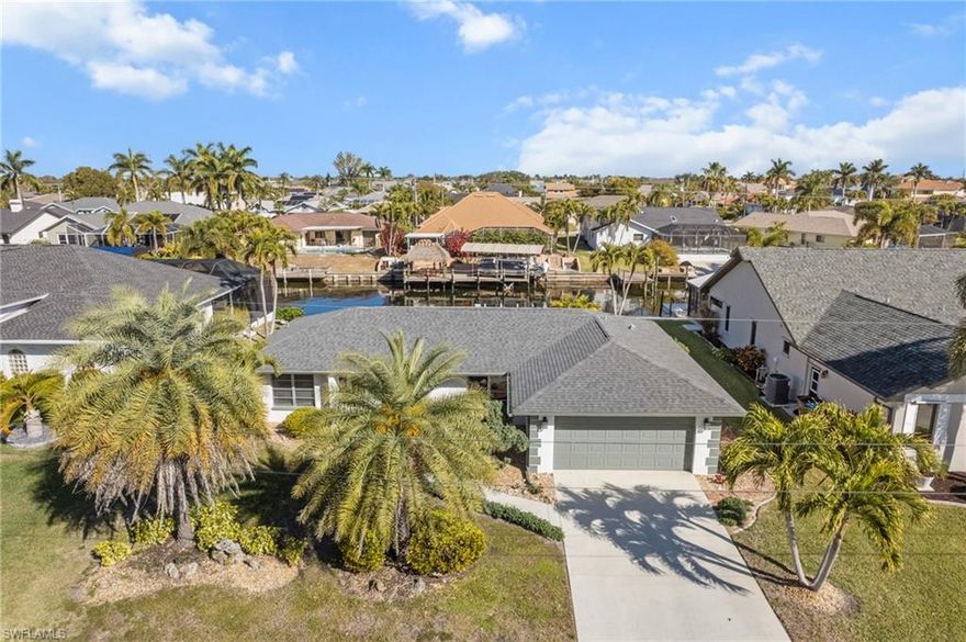 Direct No Bridges Sailboat Access | Deep Water | Move-In Ready

Location matters—and this one delivers. Situated on a deep-water direct sailboat-access canal just off Chiquita Blvd near Cape Harbour, this fully renovated waterfront home puts you minutes to the river with no bridges in your way. Bring the boat and go.

Inside, the home has been thoughtfully updated from top to bottom with a brand-new kitchen and bathrooms, matching tile floors throughout, and a split floor plan topped with cathedral ceilings that keep the space light, open, and comfortable. One of the bathrooms conveniently serves as a pool bath, ideal for a future pool or hot tub.

Step outside to an oversized screened lanai, perfect for entertaining or relaxing after a day on the water. The yard features an irrigation system to keep everything looking sharp year-round.

Best of all, this home is walking distance to Publix, Walgreens, restaurants, and everyday conveniences—a rare combo with sailboat access.

Furniture is negotiable, making this an easy, turnkey option whether you’re looking for a full-time residence, second home, or investment.

Bottom line: deep water, prime location, fully renovated, and ready to go. Homes like this don’t last.