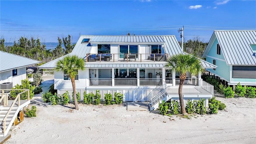 Picture yourself on island time where contemporary coastal elegance meets the pristine shores of Captiva Island. This 5 bedroom, 4 1/2 bath Gulf front gem represents the thoughtfully reimagined collaborative vision of Amy Nowacki's architectural expertise, Will Smith's masterful construction, and Aniko's inspired interior design—creating a space that's as refined as it is relaxed. Step inside where every thoughtful detail whispers "come as you are" while surrounding you with serious comfort. The heart of this stunning home showcases a chef’s dream kitchen featuring Subzero, Wolf, and Bosch appliances and custom wet bar that make whipping up everything from morning coffee to sunset cocktails feel like pure joy. The contemporary coastal vibe flows naturally throughout, blending clean, modern touches with those warm, beachy textures that make you want to kick off your shoes and stay awhile. The upper level unfolds like a private resort—a wonderfully spacious family room, bonus room and full bath with exceptional panoramic Gulf views. Watching dolphins play in the waves or catching those legendary Captiva sunsets becomes your new favorite daily ritual. The perfectly placed wet bar makes entertaining friends and family a breeze, while that extended upper sundeck creates the ultimate indoor-outdoor hangout spot where island breezes are always present. Three generously appointed ensuite bedrooms, bunk and bonus rooms give everyone their own luxurious retreat to unwind. The primary bedroom is your personal sanctuary, while a delightful bonus room offers endless possibilities with impressive closet space that opens gracefully to both the family room and that amazing deck—perfect for morning coffee or evening stargazing. The architectural improvements extend beyond mere aesthetics, with a new standing seam metal roof providing both durability and visual appeal against the island’s subtropical elements. Thoughtful landscaping is currently underway transforming the property into a lush tropical oasis that feels perfectly at home in Captiva's stunning natural setting. Literally footsteps away the beach, the Beach Home pool and Tennis Court create an active lifestyle playground. This exceptional residence sits within the exclusive South Seas Resort community where world-class amenities to include the Captiva Course, recently opened Beach House gulf front restaurant, Captiva Landing watersports and resort’s Yacht Harbour catering to nautical enthusiasts are available with Club Captiva membership. The abundant wildlife, sea life and pristine natural environment offer daily reminders of why Captiva remains a most coveted destination. For those considering investment potential, this property offers exceptional rental income opportunities within the resort’s established vacation rental program, combining your own personal enjoyment with financial returns in one of Florida’s most desirable markets.