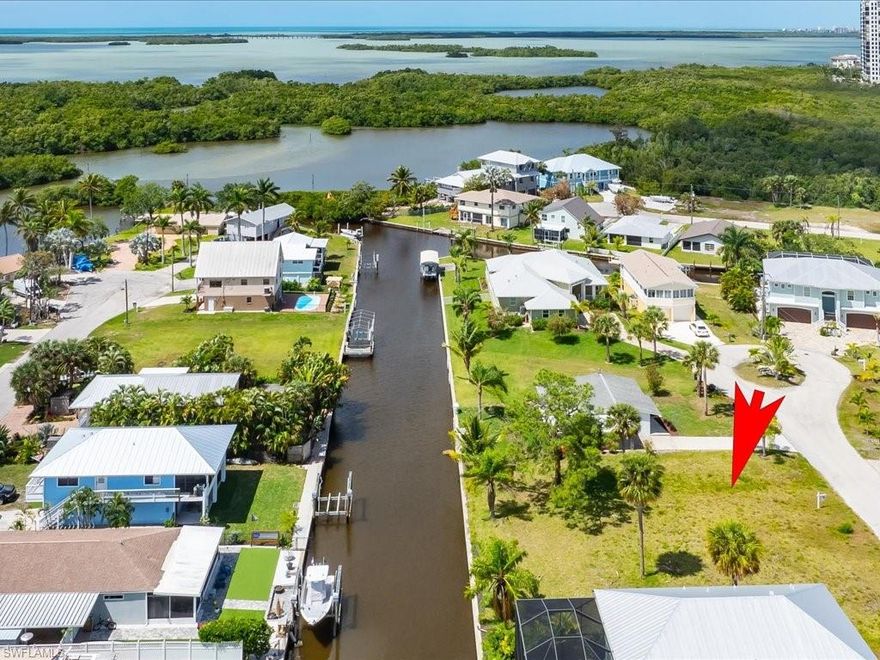 WOW! Opportunity! LOTS OF NEW CONSTRUCTION IN NEIGHBORHOOD! This LEGENDARY DIRECT GULF ACCESS lot is ready for your dream home!! Rarely available SEAWALLED LOT in the community of Estero Bay Shores! Desirable Southern Exposure on rear of property, perfect for unforgettable sunsets and afternoon sun. Quick ride into Estero Bay and then into the GULF OF MEXICO! No HOA fees! Enjoy Lovers Key State Park and New Pass everyday! You can build up to 35' high. Minutes to Coconut Point and the Hyatt Resort as well as the new Ritz Carlton Residences of Estero Bay currently under construction a mile away! This is a perfect opportunity to finally build that direct gulf access home you want! Drive By anytime and see this gem! Only a few minutes by boat and you are at New Pass as well as Bonita's Dog Beach! Lot is approx 50x100