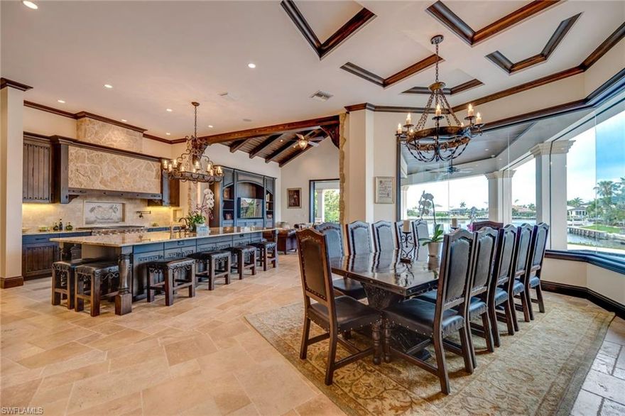 Spectacular waterfront estate designed for today’s SW Florida lifestyle offering Old World European craftsmanship and modern amenities.Masterfully constructed by Big Island Builders in 2015, this home features expansive views with 181’water frontage.4,914 Sq.Ft. of air-conditioned space showcases coffered volume ceilings, magnificent wood & marble floors and intricate hand-crafted millwork by Amish artisans.Formal living room, dining room, great room and full bar create gracious entertaining spaces. Well-appointed kitchen features custom cabinetry, top-of-the-line chef’s appliances, and hand-selected natural stone. The 4 bedrooms, spacious Den, 5 full baths provide luxury and privacy for family and visitors.This Estate Home is filled with absolute top end finishes including wide plank wood and marble, whole house Generator, 1000 Gallon propane tank, surround sound, retractable shutters and an unparalleled combination of attributes including solid concrete construction, Anderson windows, energy-efficient materials. A waterside heated pool and spa, private dock with boat lifts, complete this truly unique property. Golf Membership is avl. at Members Club at Marco.Call for details.