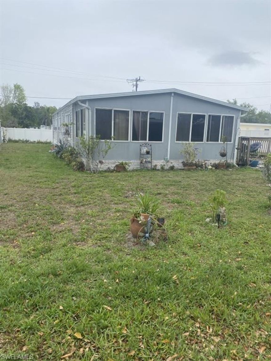 Double-wide (1972) with 4 bedrooms plus converted lanai for a 5th. Metal roof (12 yrs), wall A/C, city water/sewer. Kitchen has new fridge and sink; other features mostly original. Laundry room with new washer/dryer. Shed on site.
monthly HOA includes trash, clubhouse, and access to 2 pools.