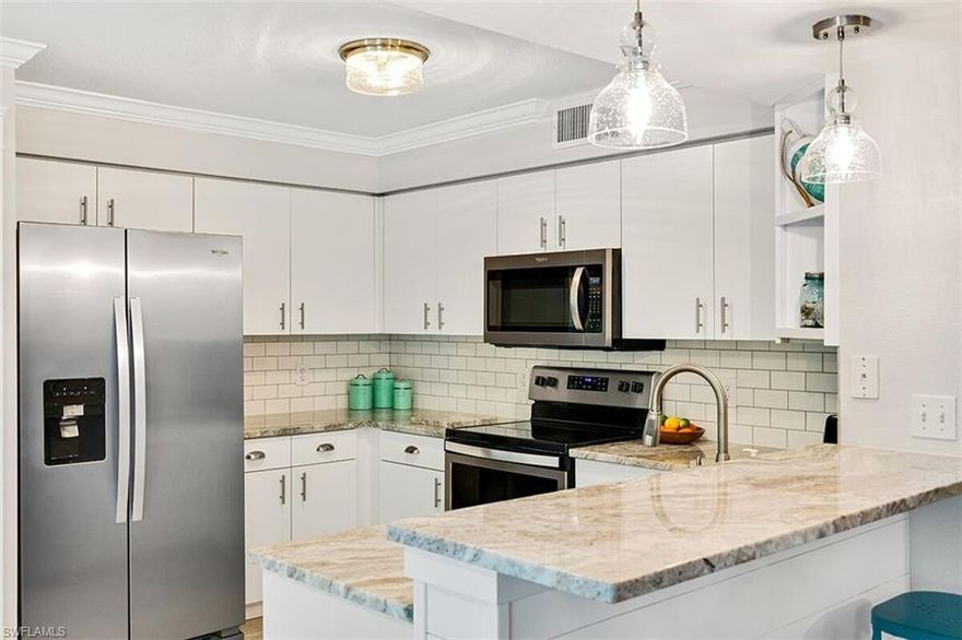 Impressive condo with all the updates you have been waiting for. Large open floor plan allows you to show off and entertain. Kitchen has been remodeled with stainless steel non-smudge appliances, beautiful granite countertops, large undermount stainless sink, brand new tile floor, crown molding and more. Fresh paint, flooring, baseboards, light fixtures, window coverings throughout. Master bath completely redone to include new vanity, tile floor, gorgeous walk in shower complete with subway tile. Extra touches make this condo stand out above the rest. Detached garage. Gated complex with amenities galore including community pool and spa, BBQ area, access to all amenities at Villages of Bonita which include another community pool and spa, tennis courts, shuffle board and fitness center. Convenient location close to shopping, restaurants and beaches with quick access to Naples and Estero.