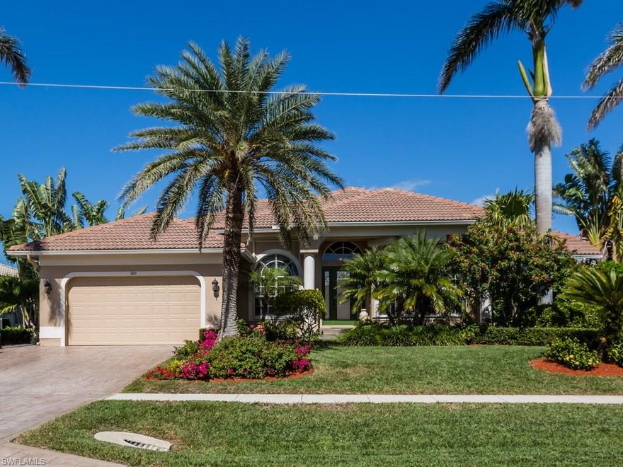 H.12739 - Rare opportunity to own a home in paradise just a few blocks to the beach, have your boat in your backyard. Many upscale features in this stunning home that you must see including travertine floors throughout the living areas and hardwood floors in the bedrooms, coiffured ceiling in the living room and copper tray ceiling in the dining room. Gourmet kitchen offers new granite and custom handmade backsplash. Master bedroom offers spacious walk in closet with custom built ins, walk in shower and Jacuzzi tub, new Onyx counters on vanity. Enjoy outdoor living with spacious screened lanai, large PVC sun deck on the water and easy maintenance paver backyard for lounging in the sun.:  Homes offers electric shutters, impact sliders and one window with clear hurricane panels.  Home offers electric storm shutters and all sliders are new impact hurricane rated. You must see this home to appreciate all it has to offer.