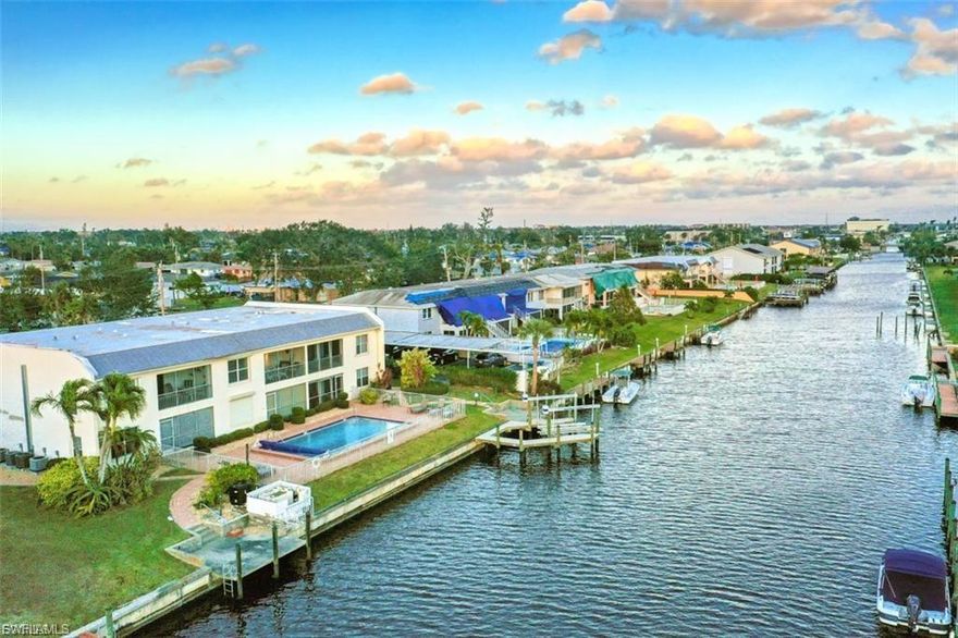 Sun-drenched, waterfront-inspired living meets the vibrant energy of Downtown Cape Coral in this exceptional corner end-unit—an offering that effortlessly blends coastal elegance, investment potential, and an unbeatable location. Perfectly positioned within an intimate, beautifully maintained community of just six residences, this turnkey furnished 2-bedroom, 2-bath condo delivers both privacy and convenience, making it an ideal full-time residence, seasonal retreat, or high-performing rental opportunity.

Bathed in natural light from its coveted southern exposure, this bright and airy home showcases a seamless indoor-outdoor lifestyle, highlighted by a spacious screened-in lanai where you can unwind, entertain, and take in breathtaking sunset skies. Every detail invites relaxation, creating a peaceful sanctuary just moments from the excitement of downtown living.

Designed with boating enthusiasts in mind, this property offers a rare opportunity to reserve a private boat dock and lift, with renderings available—placing you just a short 10-minute ride from the Caloosahatchee River and open Gulf waters beyond. Whether it’s spontaneous sunset cruises or weekend adventures on the water, this is true Southwest Florida living at its finest.

Located just a quick walk or bike ride to Cape Coral’s iconic 47th Terrace, you’ll find yourself immersed in a dynamic waterfront lifestyle filled with top-rated dining, boutique shopping, live entertainment, and year-round events. Yet, within your own residence, you’ll enjoy a quiet, serene atmosphere that feels worlds away.

This pet-friendly community—with no age restrictions—offers exceptional flexibility, including seasonal rental options (up to twice per year) or annual leasing. With a strong rental history, this property stands out as a smart and versatile investment.

Opportunities like this are rare—where location, lifestyle, and long-term value converge into one unforgettable property. Whether you’re drawn by the boating access, the walkable downtown lifestyle, or the effortless turnkey convenience, this residence is a must-see for those seeking their own slice of paradise in Cape Coral.