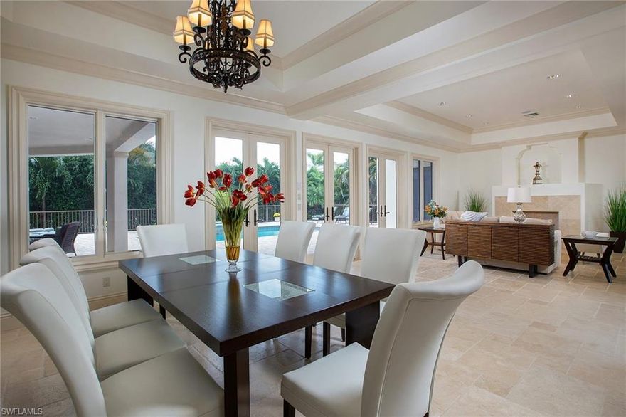 This impressive Moorings residence offers preferred southern exposure and over 5,500 square feet of living space. Five bedrooms with four-and-two-half baths, office and first floor media room or optional sixth bedroom, make this an ideal residence. The spectacular master suite includes sitting area, dual walk-in closets with built-ins, master bath with his-and-her water closets, dual sinks, jetted tub and walk-through shower. Gourmet grade appliances, including a six-burner gas cooktop are found in the massive kitchen that opens to the outdoor resort-style pool and spa with large summer kitchen and pool bath. A nearby formal dining area provides a full wet bar and glass front wine fridge. This generous floor plan affords a large study, living room with gas fireplace, spacious loft and 28x15-square-foot flex room that can be utilized as a playroom or upstairs family room.