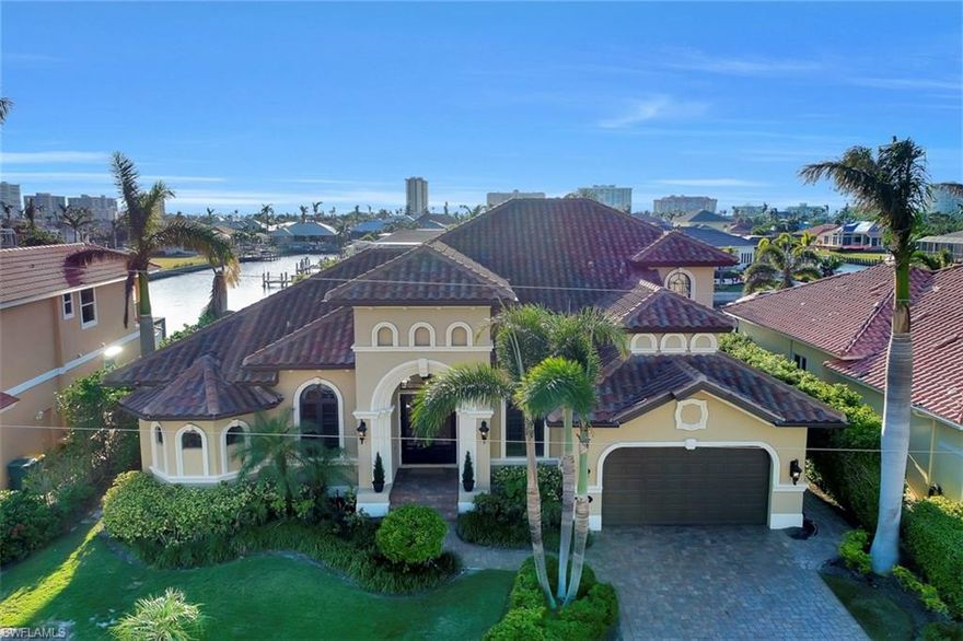 Embrace perfection in this luxurious Marco Island waterfront home offering sparkling views of long waters & converging waterways. As you welcome your guests though the wooden French doors, their eye will be drawn to champagne-taste design throughout over 3,100 square feet highlighted by archways, crown moldings & large windows onto tranquil waters. There is plenty of space for a growing family in this 2 story Piece of Paradise offering 4 bedrooms, 2 living spaces, a sizeable den & tons of outdoor entertainment space. The island kitchen has custom cabinetry, granite countertops, walk-in pantry & 3 indoor dining areas. For the enjoyment of sunlit days, take advantage of southwestern exposure & the tranquil setting of screened lanai & open 2nd story balcony. BBQ in the summer kitchen w/stainless steel appliances, or take a dip in the heated swimming pool & spa as you watch the dolphins at play. Looking to explore? Launch off your one-of-a-kind 20,000LB hydraulic dock system & hit the open waters under Marco’s tallest inland bridge. Retire your day to lawn-side seating area and enjoy the custom lit & artistically landscaped grounds. Don’t miss the 3D WALKTHROUGH.