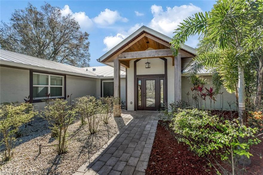 You don't want to miss this totally remodeled home in an Equesterian Community on 5+ acres!  This home includes a 36 x 40 RV garage and would hold four additional cars plus has a 2 car attached garage, a Galvalume Metal Roof 2017, A/C RUUD 2017, hot water heater 2017, 500 gal. reverse osmosis water system. security system, high impact glass windows and doors, quartz and granite counter tops, cabinets with pull outs, stainless appliances with farm house sink, barn doors on closets and large walk-in pantry.  This home will exceed your expectations!   Bring your horse, RV or car collection.