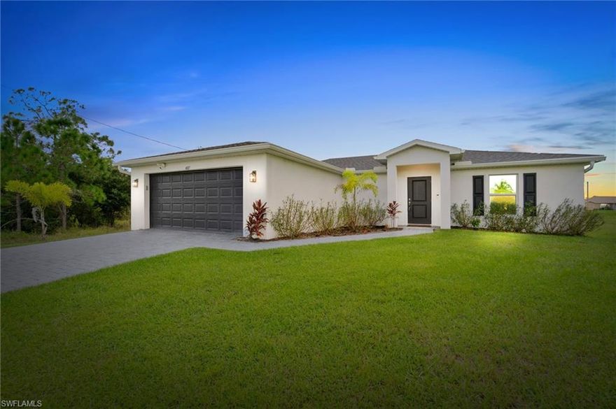 Move In Ready!! Welcome to your dream home in the heart of Lehigh Acres! This stunning Newly-Built house, completed in 2023, offers a perfect blend of modern design and functionality. Boasting 1,400 square feet of living space, this home features an open floor plan that seamlessly connects the kitchen, dining, and living areas, providing ample space for entertaining or relaxing. The kitchen is a chef’s delight, complete with elegant white shaker cabinets, pristine quartz countertops, and GE kitchen appliances. The split floor plan ensures privacy, with the owner’s suite offering a luxurious retreat. It includes dual vanity sinks, sleek quartz countertops, and a spacious walk-in closet. The guest bathroom is conveniently designed with a tub/shower combo. The home features tile floors throughout the main areas, with cozy carpeted bedrooms for added comfort. Enjoy the Florida lifestyle with a screened-in rear patio, perfect for morning coffees or evening gatherings. The property is equipped with impact windows and doors, ensuring safety and energy efficiency. Additional conveniences include a two-car garage, an in-residence washer and dryer, and a built-in irrigation system to maintain your lawns’ beauty. Located just a short drive from State Route 82 and Daniels Parkway, this home offers easy access to the Southwest Florida International Airport and I-75, making commuting a breeze. This is an ideal location for those seeking a balance of tranquility and connectivity. Immaculate and move-in ready, this house truly shows like a model home. Home still has about 9 years left on the builders warranty.  Don’t miss out on this exceptional opportunity!