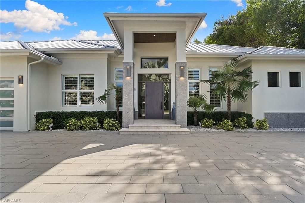 Photo of 720 Orchid DR, NAPLES, FL 34102 (MLS # 225076014)