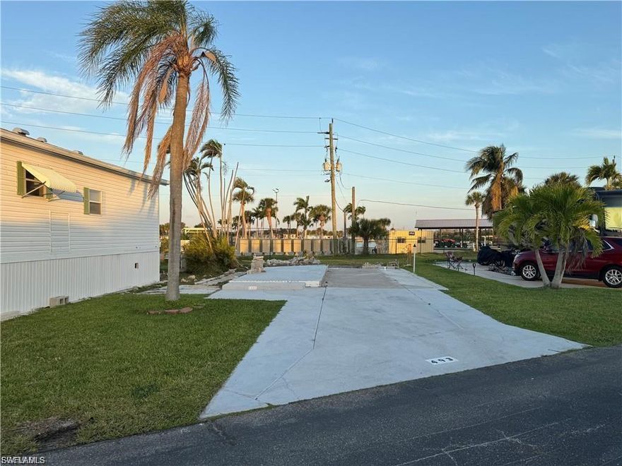 Welcome to Palmetto Palms where YOU own the land. This fantastic lot is PET FRIENDLY, has 50 AMP electric post already installed, has lake views, and no neighbors behind! Located on L street, this location is great for watching sunrises over the lake, and sunsets over the mangrove. This lot will accommodate a new manufactured home, camper, fifth wheel, ANSI park model, or RV. Palmetto Palms is a 55+ gated community that offers, tennis, shuffleboard, volleyball, pickle ball, volleyball, horseshoes, and a variety of other activities. Located just 1 mile from Bunche Beach County Park on the Gulf of Mexico where you can rent kayaks, and just 3 miles from Times Square Fort Myers Beach makes this location ideal. Shopping, bars, and restaurants within walking distance. Welcome to paradise!