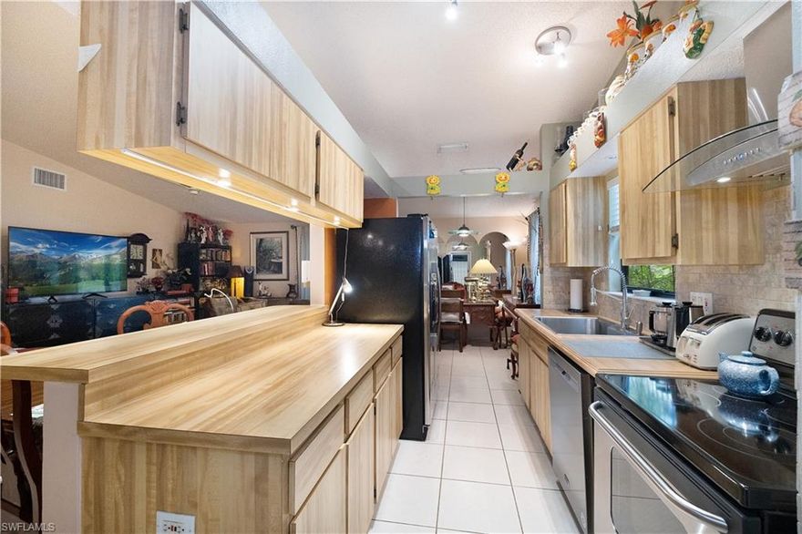 Great location! Less than 1.5 miles to the beach. This well-built, original owner, Ryan home is centrally located; just minutes to the beach, downtown, and just about anywhere! This 3 plus den, 2 bath features a galley kitchen, stainless steel appliances, and tile flooring. Lovely sun room with three pocket sliders and tile floors makes this a peaceful retreat that welcomes nature in. The den is a nice size, perfect for a home office. The living area is sizable and features cathedral ceilings and sliders that open to the screened in lanai and soothing hot tub. Fruit trees adorn the tranquil fenced-in yard, ideal for your fur babies to roam. Natural landscape material gives this property a truly tropical feel. Main bedroom is adequate with the closet and main bathroom adjacent to the room. There is also a shed to store your outdoor equipment. Shopping, restaurants, theaters, libraries, schools, post office, Artis of Naples, and so much more is in close proximity. No damage from the recent storm.